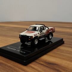 1985 Toyota Hilux Single Cab-Class 7s White & Red 1:64